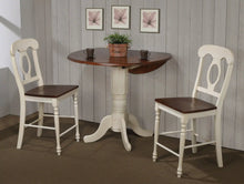 Load image into Gallery viewer, Sunset Trading Andrews 3 Piece 42&quot; Round Extendable Drop Leaf Pub Table Set | Antique White and Chestnut Brown | Napoleon Stools | Seats 4